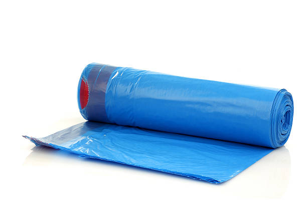 istock roll of blue garbage bags 153162142