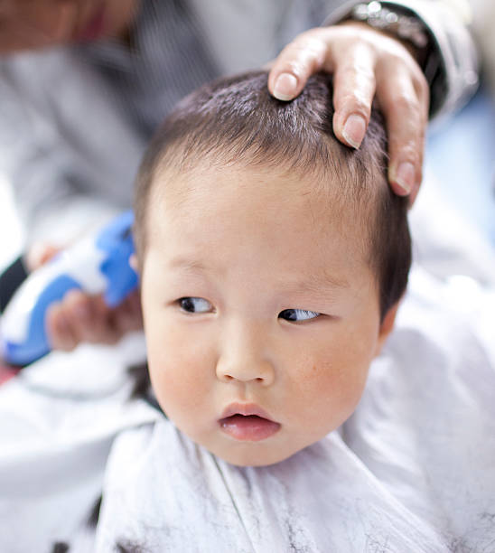 istock asian baby haircutting 153162248