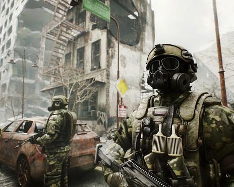 Digitally generated post apocalyptic scene depicting the consequence of a nuclear holocaust, showing future soldiers wearing heavy tactical equipment and gas masks exploring a desolate urban landscape with buildings in ruins and mostly cloudy sky.The scene was created in Autodesk® 3ds Max 2024 with V-Ray 6 and rendered with photorealistic shaders and lighting in Chaos® Vantage with some post-production added.