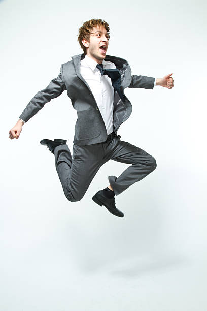 istock happy businessman jumps 153163156