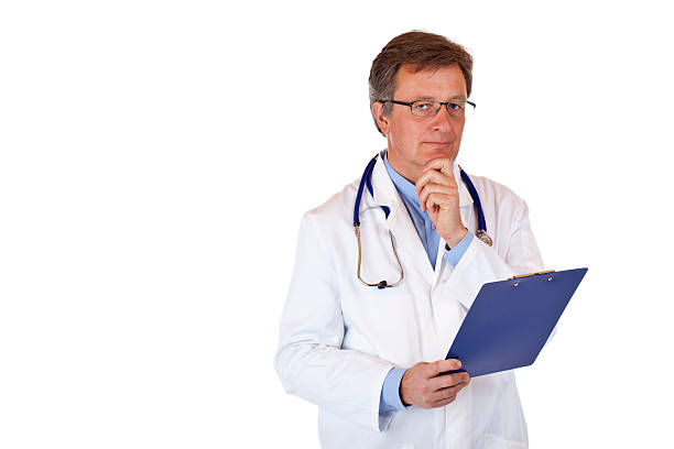 Symphatic, contemplative medical doctor holds health record in hands stock photo