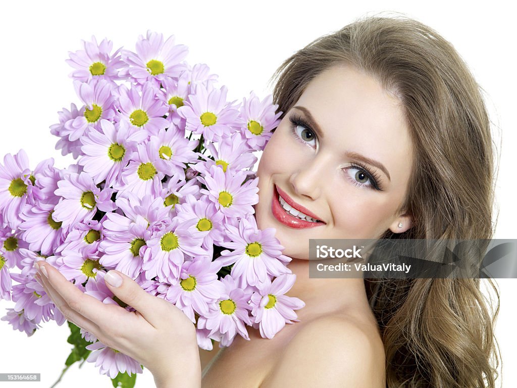 Happy woman with spring flowers Portrait of happy smiling beautiful girl with spring flowers - white background Adult Stock Photo