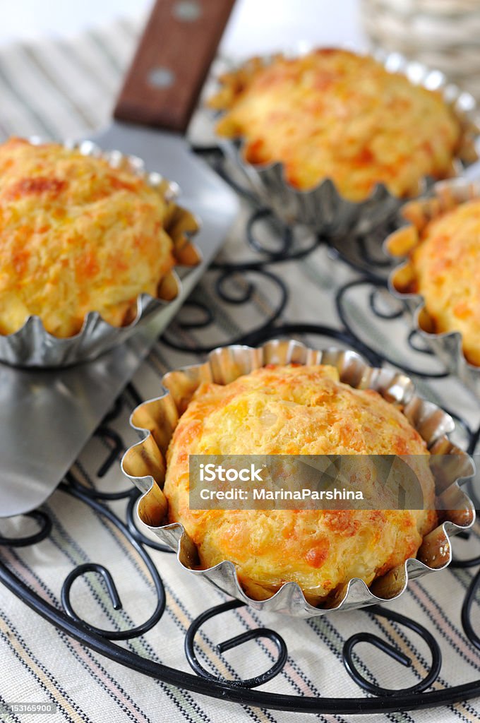 Pumpkin-Cheese Muffins Just baked pumpkin-cheese muffins. Baked Stock Photo