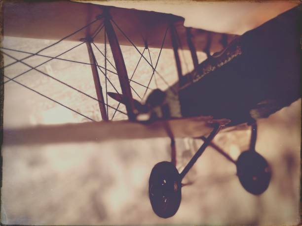 istock Model Biplane against a city Background 1531660609