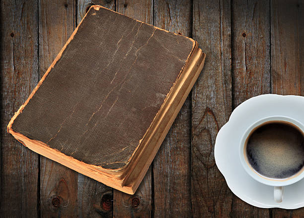 istock old book and a cup of coffee 153166874