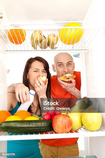 Couple Eating Cakes Stock Photo - Download Image Now - Food, Full, Men