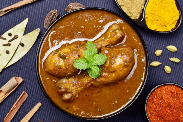 istock Spicy chicken curry top view, whole spices 1531676916