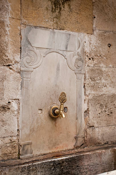 istock water tap outside mosque 153168147