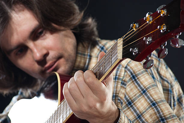 istock Guitarist plays on a guitar 153168202