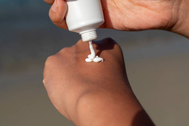 istock Woman hand apply sunscreen 1531683567