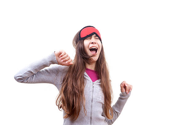 Teenager yawning at morning stock photo