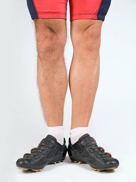 istock cyclist with a half-shaven legs 153169173
