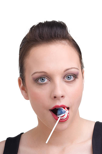 istock Girl with candy in mouth 153169280
