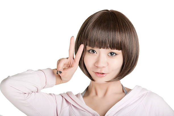 Beautiful Chinese woman displaying some attitude on a white background
