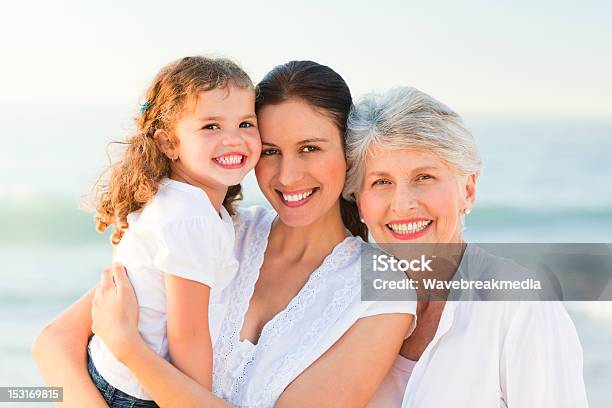 Lovely Family At The Beach Stock Photo - Download Image Now - Active Seniors, Adult, Beach