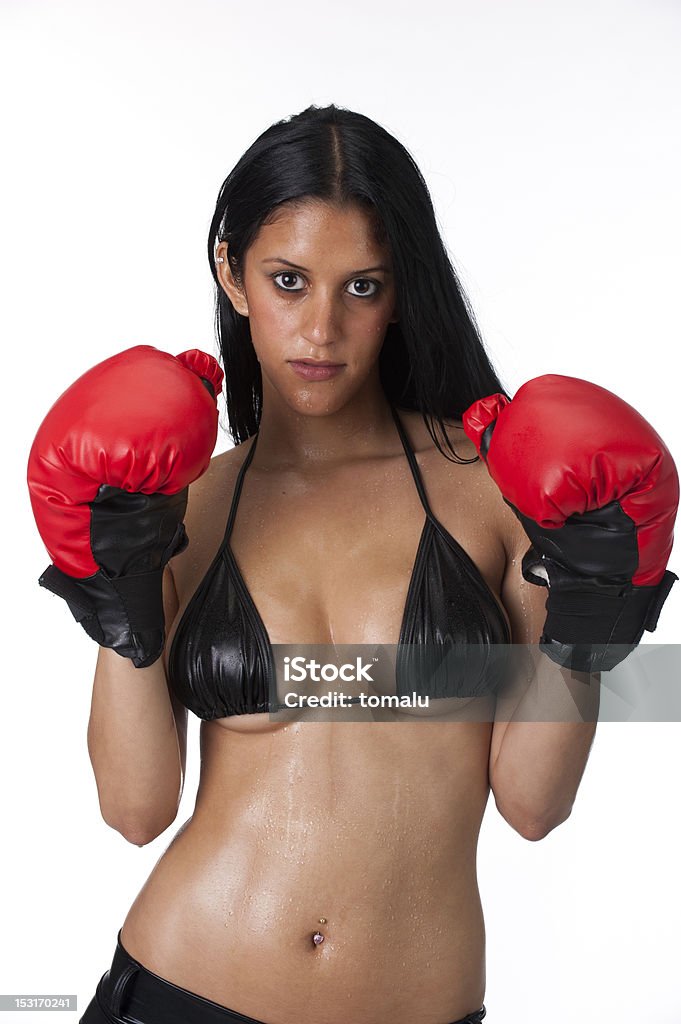 Attractive Boxer Attractive hispanic woman training with boxing gloves and sweaty. 20-29 Years Stock Photo