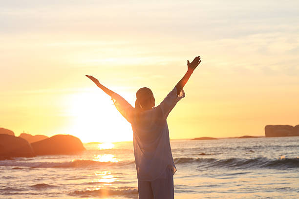 istock Woman practicing yoga at the beach 153170264