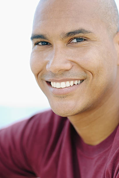 istock young latino man smiling at camera 153170276