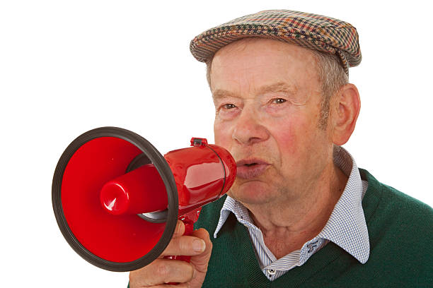 masculino sénior com megafone - senior adult human face male action imagens e fotografias de stock