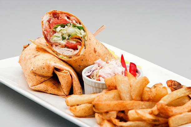 Chicken Wrap and french fries stock photo