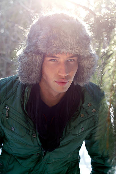 Portrait of a young man in winter outerwear stock photo