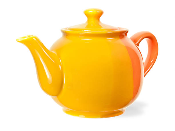 Bright yellow and orange teapot isolated on white