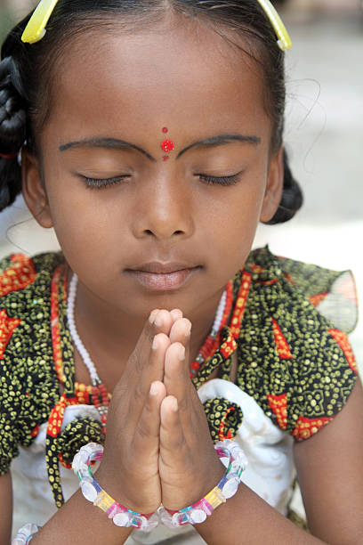 istock Cute Little Girl Praying 153171567