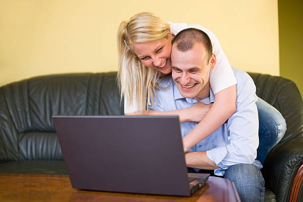 istock Young couple having fun with laptop. 153172239