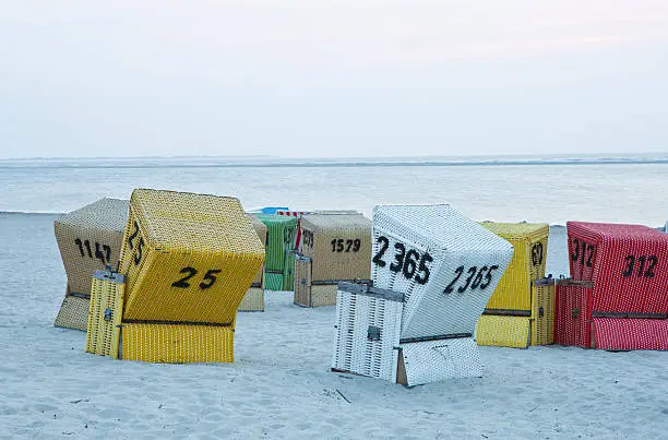 The picture shows some beach-chairs in the evening