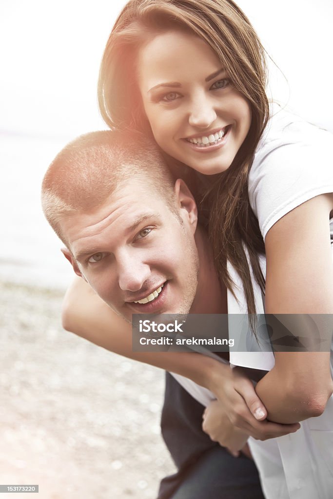 Happy caucasian couple A beautiful happy caucasian couple in love on the beach 20-29 Years Stock Photo