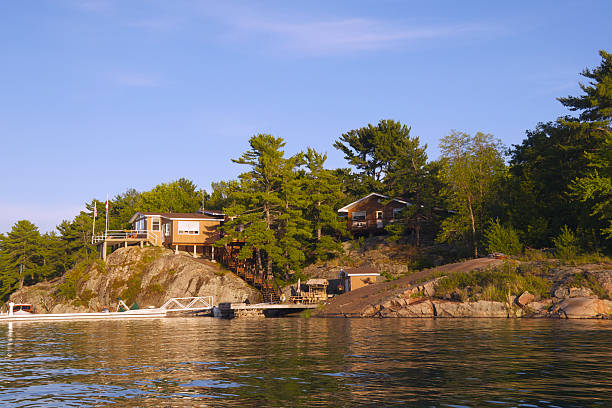 istock Sun Setting Over Lake Shore Cottages 153173975