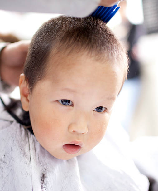 istock asian baby haircutting 153174190