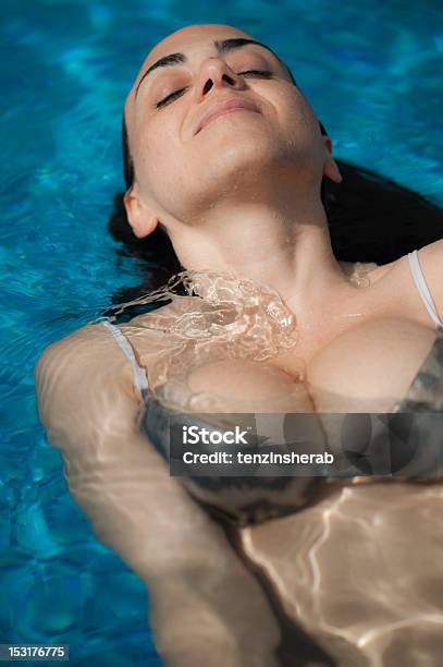 Young Woman Relaxing In Pool Stock Photo - Download Image Now - Bikini, Swimming Pool, Adult