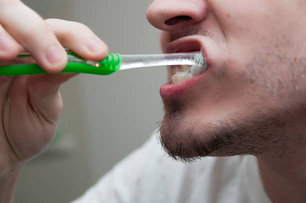 istock Teenager brushing teeth 153177012