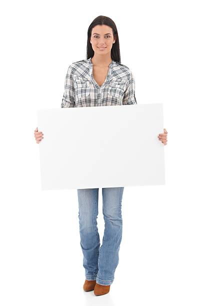 istock Attractive girl holding a white panel smiling 153177609