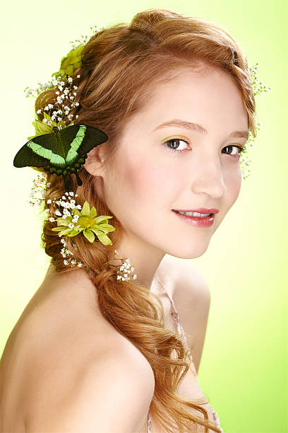 beautiful girl and butterfly portrait of beautiful healthy redhead teen girl with flowers and butterfly on her hair papilio palinurus stock pictures, royalty-free photos & images