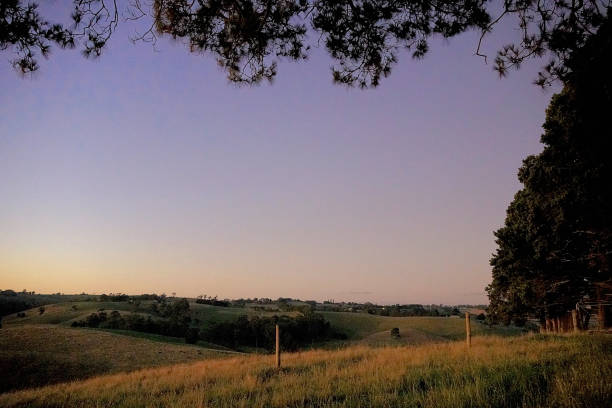 Sun setting over rural farmland close by Korumburra is a town in the Australian state of Victoria. It is located on the South Gippsland Highway, 120 kilometres south-east of Melbourne, in the South Gippsland Gippsland Country