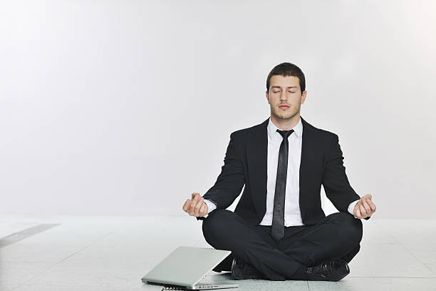 istock business man practice yoga at network server room 153179406