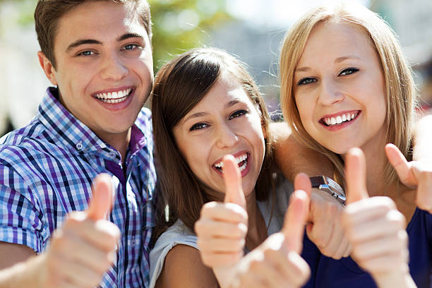 istock Three young people with thumbs up 153179757