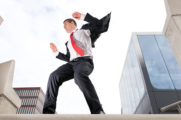 istock Jumping young business man 153180691