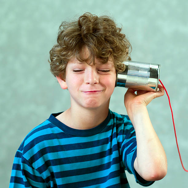 istock boy playing with a fake phone 153180835