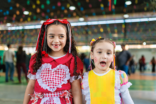 Portrait of two little girls at the school's June festival.