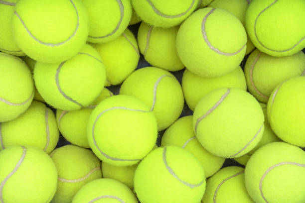 CLOSE UP OF MANY TENNIS OR PADEL BALLS BACKGROUND. CLOSE UP OF MANY TENNIS OR PADEL BALLS BACKGROUND. paddle ball stock pictures, royalty-free photos & images
