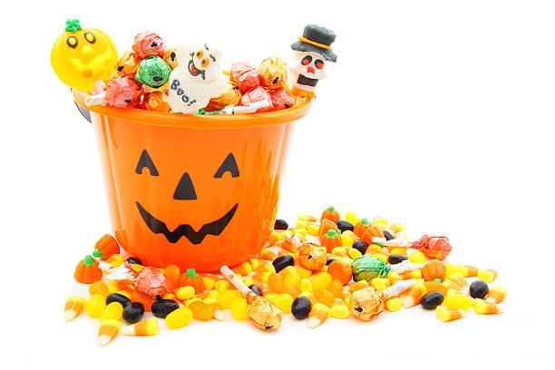 istock Halloween candy overflowing from Jack o Lantern pail 153191797