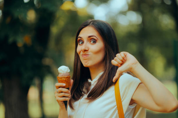 istock Woman Having an Ice Cream Feeling Disappointed with Taste 1531939605