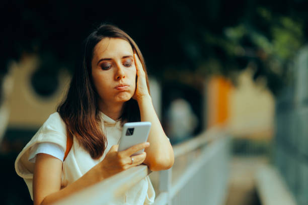 istock Worried Woman Receiving an SMS from Unknown Number 1531939617