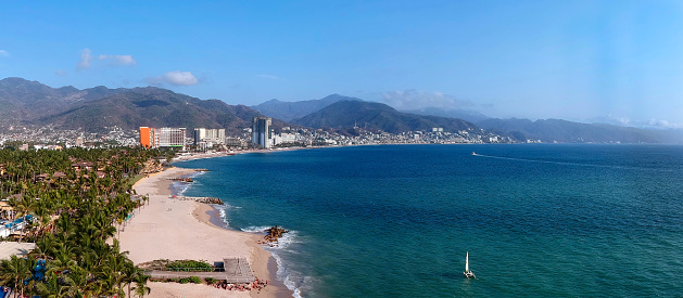 Aerial view of puerto vallarte beach with a city in the background