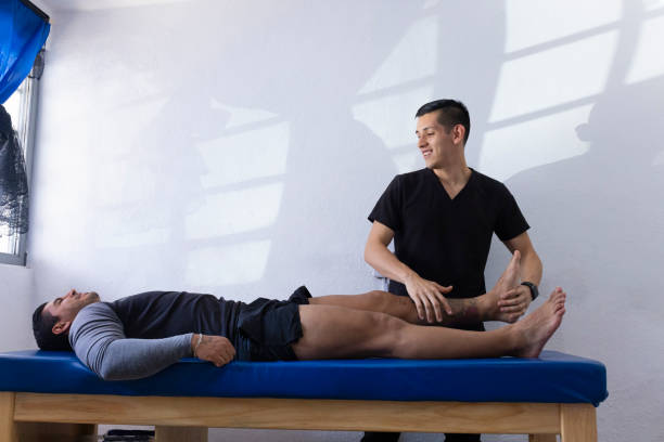 istock Physiotherapist checking the function of his patient's leg. 1531959329