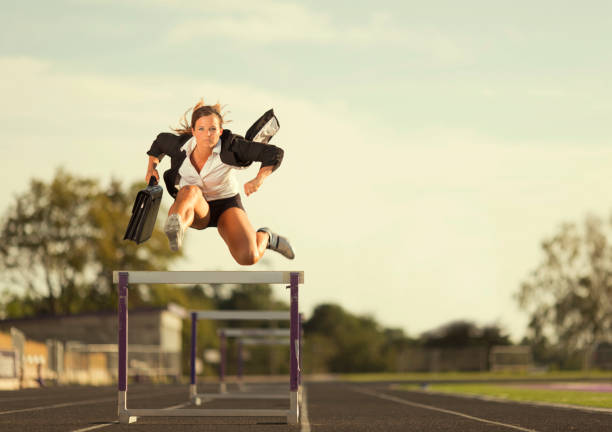 Fly Girl A speedy businesswoman flies over the business competition. Nothing will slow her down. hurdle stock pictures, royalty-free photos & images