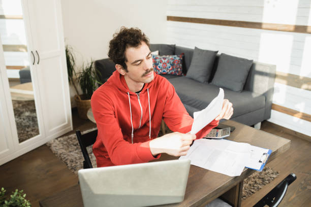 istock Portrait of a happy young man working from home 1531968651